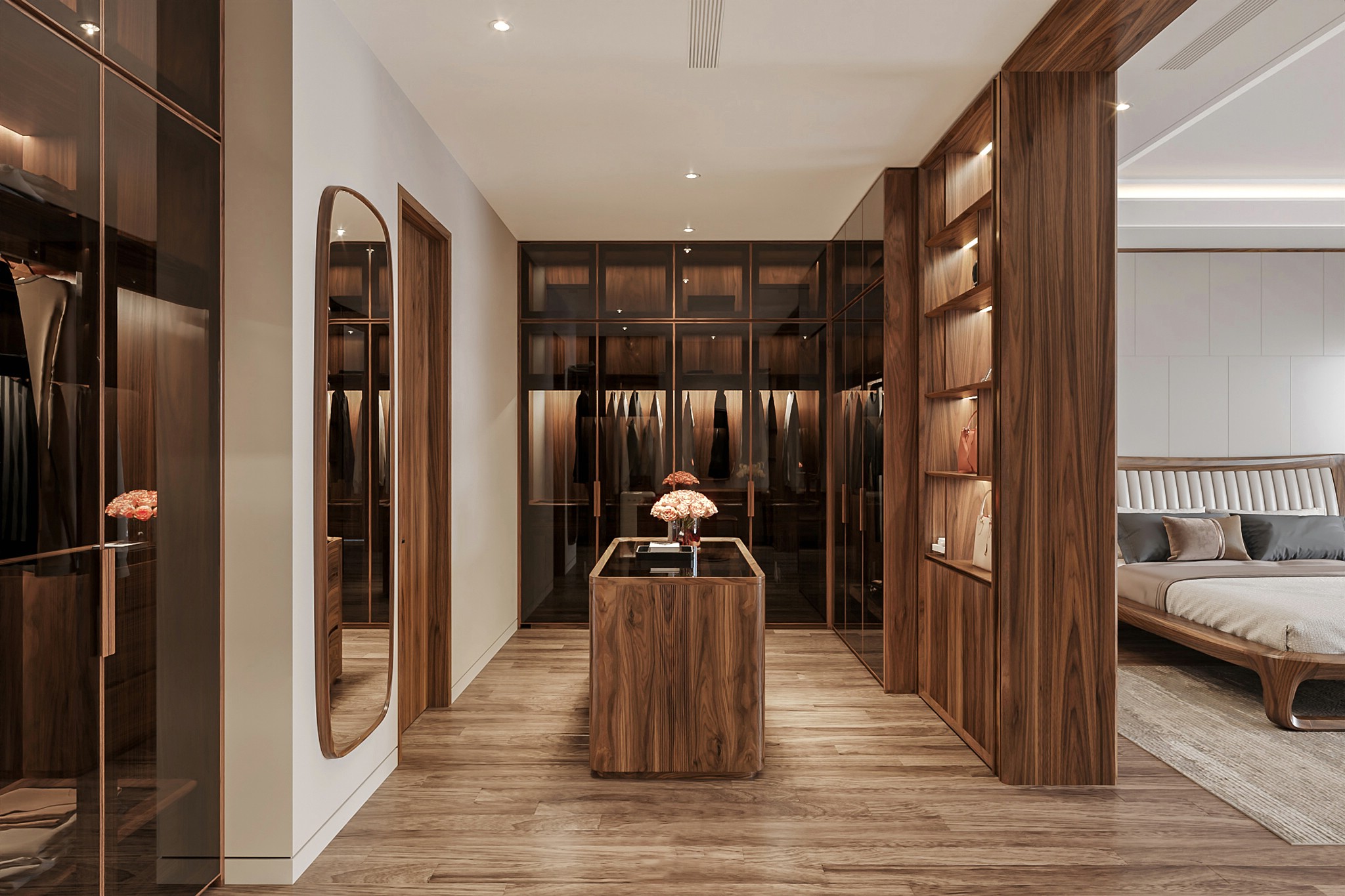 phòng thay đồ phòng ngủ gỗ óc chó với tủ áo chữ L và bàn đảo trung tâm